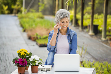 Image showing Working in a flower shop