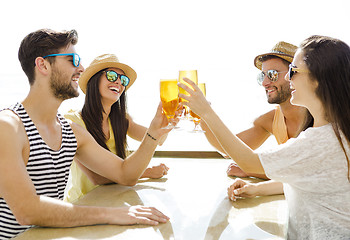 Image showing Friends drinking a cold beer