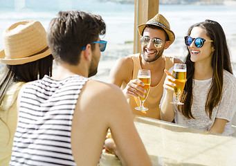 Image showing Friends at the beach bar