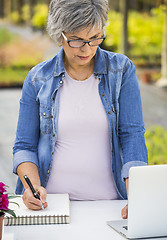 Image showing Working in a flower shop