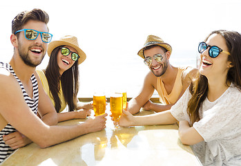 Image showing Friends at the beach bar