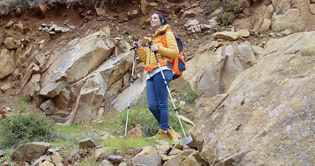 Image showing Healthy fit young woman outdoors backpacking