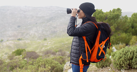 Image showing Young woman hiking on a misty day