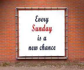 Image showing Large banner with inspirational quote on a brick wall