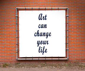 Image showing Large banner with inspirational quote on a brick wall