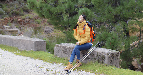 Image showing Attractive young woman hiking in the mountains