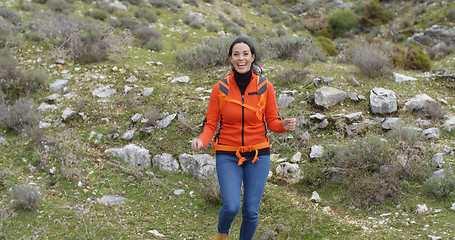 Image showing Vivacious woman enjoying a mountain hike