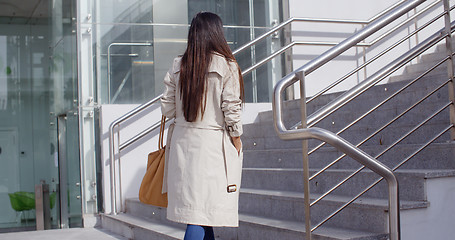 Image showing Elegant woman walking through town