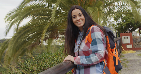 Image showing Happy friendly woman wearing a backpack