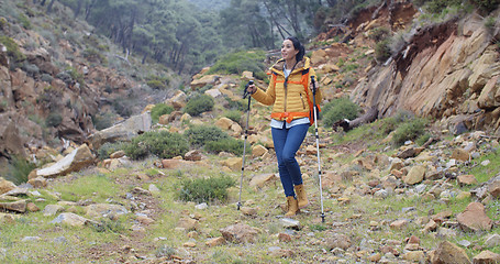 Image showing Healthy fit young woman outdoors backpacking