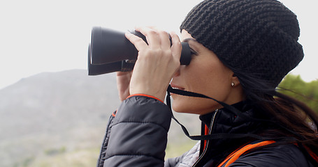 Image showing Happy smiling woman enjoying a misty hike