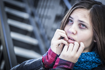 Image showing Young Bruised and Frightened Girl on Staircase