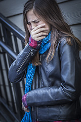 Image showing Young Crying Teen Aged Girl on Staircase