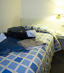 Image showing hotel room with open suitcase