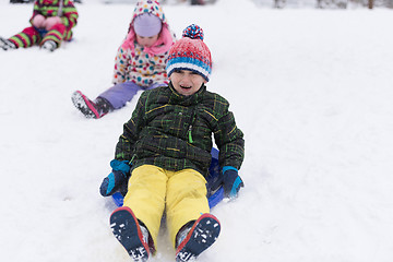 Image showing group of kids having fun and play together in fresh snow