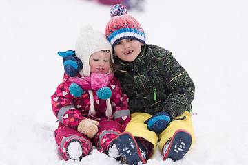 Image showing group of kids having fun and play together in fresh snow