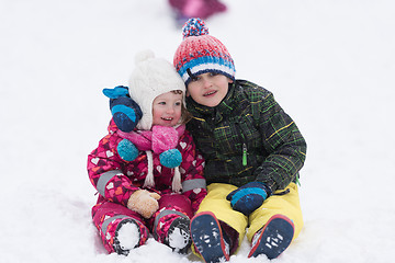 Image showing group of kids having fun and play together in fresh snow