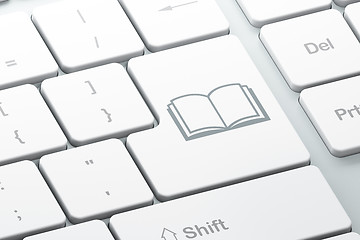 Image showing Learning concept: Book on computer keyboard background