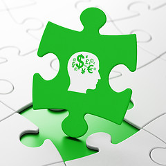 Image showing Studying concept: Head With Finance Symbol on puzzle background