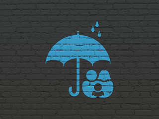 Image showing Safety concept: Family And Umbrella on wall background