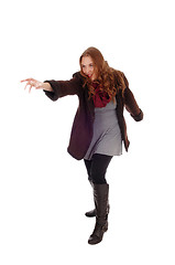 Image showing Young woman in coat and boots.