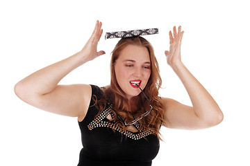 Image showing Woman balancing book on her head.