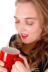 Image showing Closeup of woman drinking coffee.