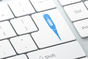 Image showing Healthcare concept: Thermometer on computer keyboard background