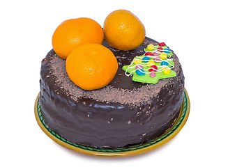 Image showing Chocolate cake and oranges on a ceramic dish on white background