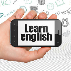 Image showing Studying concept: Hand Holding Smartphone with Learn English on display