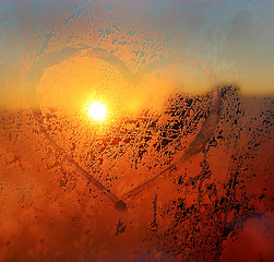 Image showing Heart drawn on the frozen winter window