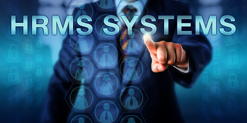 Image showing HR Manager Pushing HRMS SYSTEMS Onscreen 