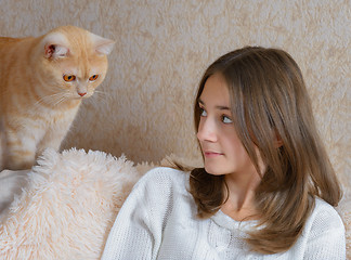 Image showing Girl and red cat