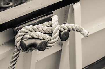 Image showing Rope tied to bollard sailboat, sepia