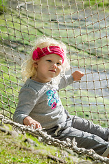 Image showing Girl swinging in a hammock