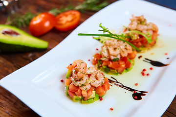 Image showing Salad with shrimps, tomato and avocado.