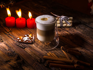 Image showing Frothy, layered cappuccino in a clear glass mug