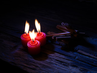 Image showing Cinnamon sticks on wooden background