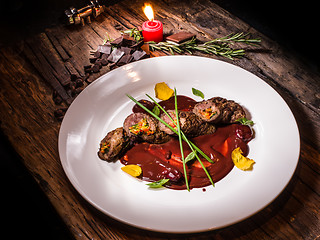 Image showing Roasted meat with vegetables and chocolate sauce