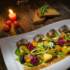 Image showing Canape from rye bread with herring slice 