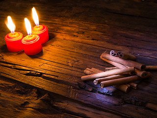 Image showing Cinnamon sticks on wooden background