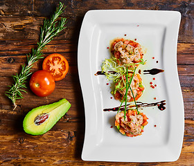 Image showing Salad with shrimps, tomato and avocado.