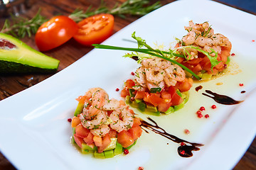 Image showing Salad with shrimps, tomato and avocado.