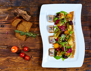 Image showing Canape from rye bread with herring slice 