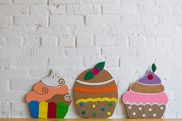 Image showing colored cakes handmade of cardboar 