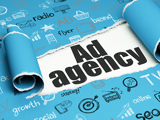 Image showing Advertising concept: black text Ad Agency under the piece of  torn paper