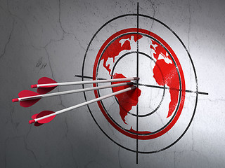 Image showing Learning concept: arrows in Globe target on wall background