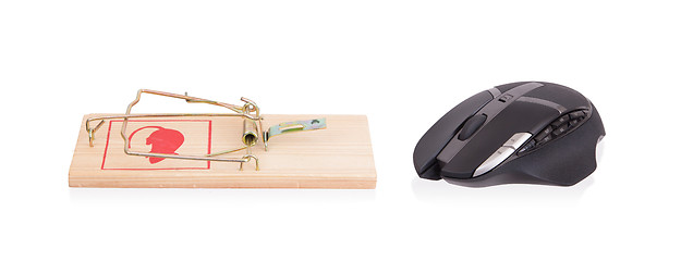 Image showing Modern computer mouse in a mousetrap