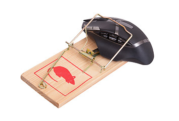 Image showing Modern computer mouse in a mousetrap