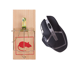 Image showing Modern computer mouse in a mousetrap